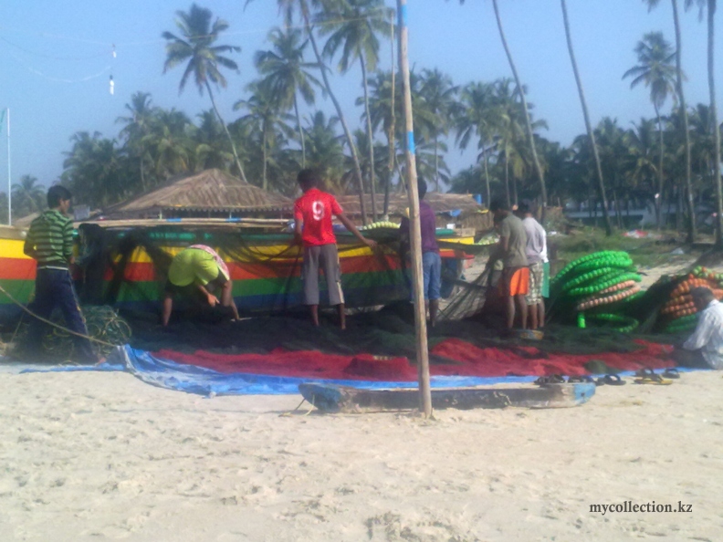 Fishermen unravel nets - Coast Of Goa.jpg